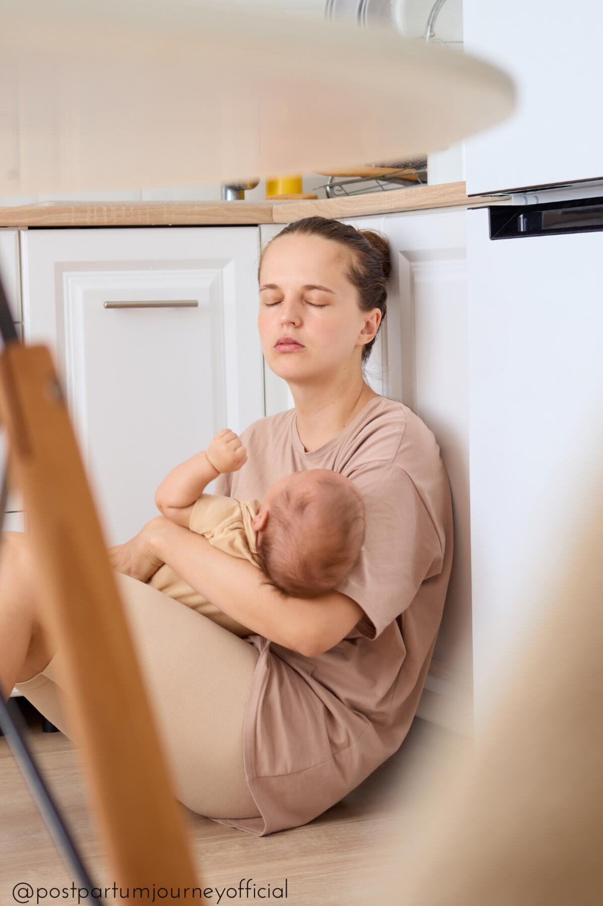 postpartum daily reset new mom hiding/sleeping on kitchen floor with baby